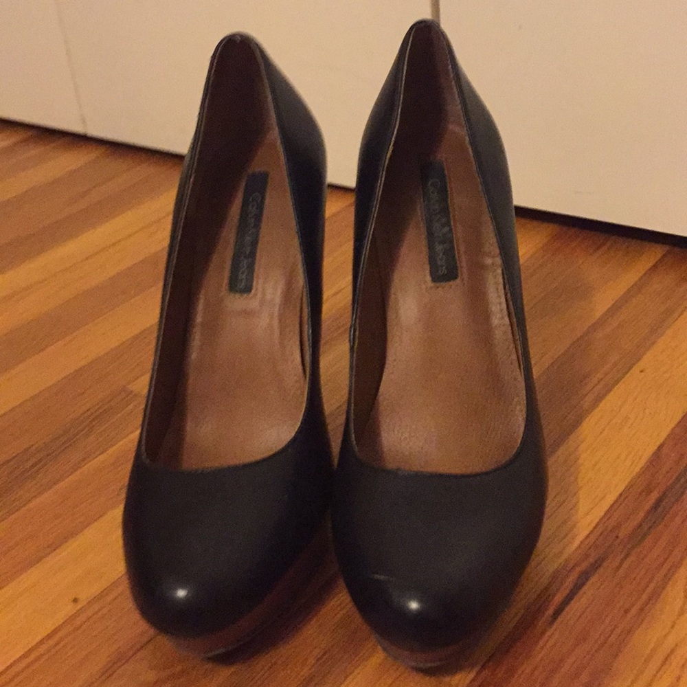 Platformed Calvin Klein shoes.